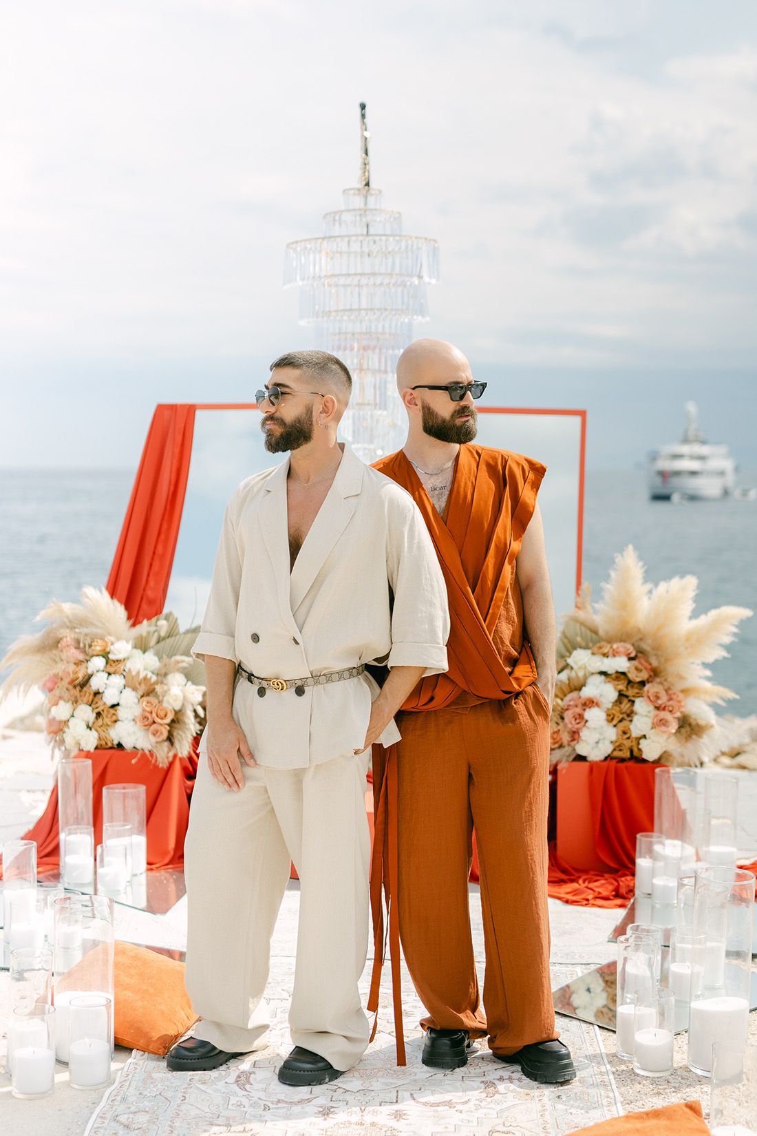 Same-sex couple portrait by the sea during an Athens Riviera wedding in Greece at golden hour.