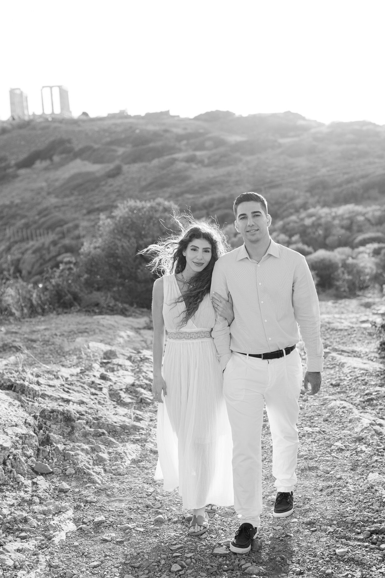 Athens Riviera couple photoshoot at golden hour, sea light and romantic editorial portraits.