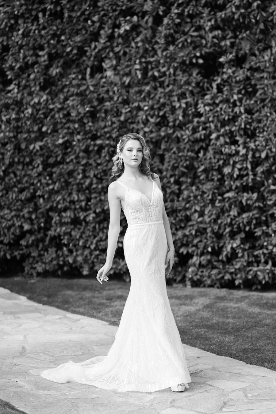 Wedding photography on stone patio with ivy wall backdrop.
