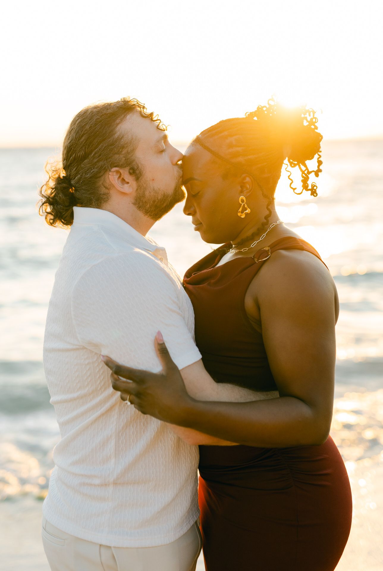 Athens Riviera couple photoshoot at golden hour, sea light and romantic editorial portraits.