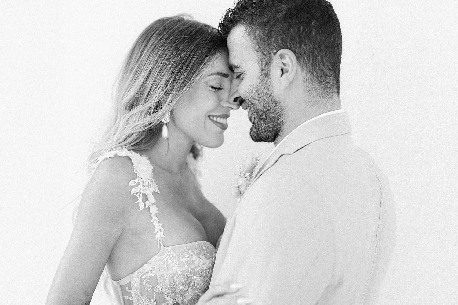 Sunset couple portrait in Greece with a refined, intimate mood and warm natural light.