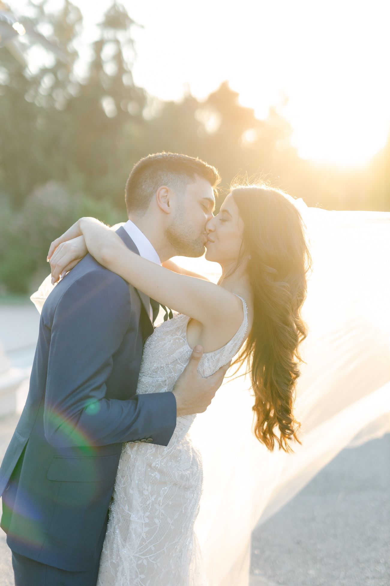 Romantic sunset moment in an elegant outdoor setting with backlit scenery.