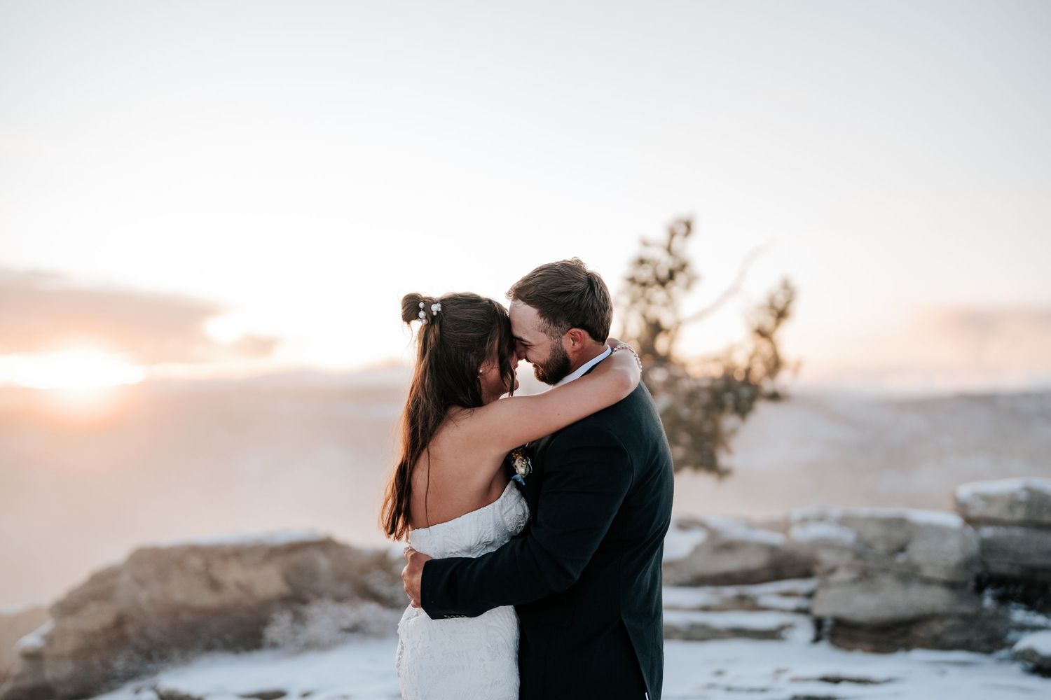 Bride and groom standing on Sentinel Dome at Yosemite National Park wedding elopement