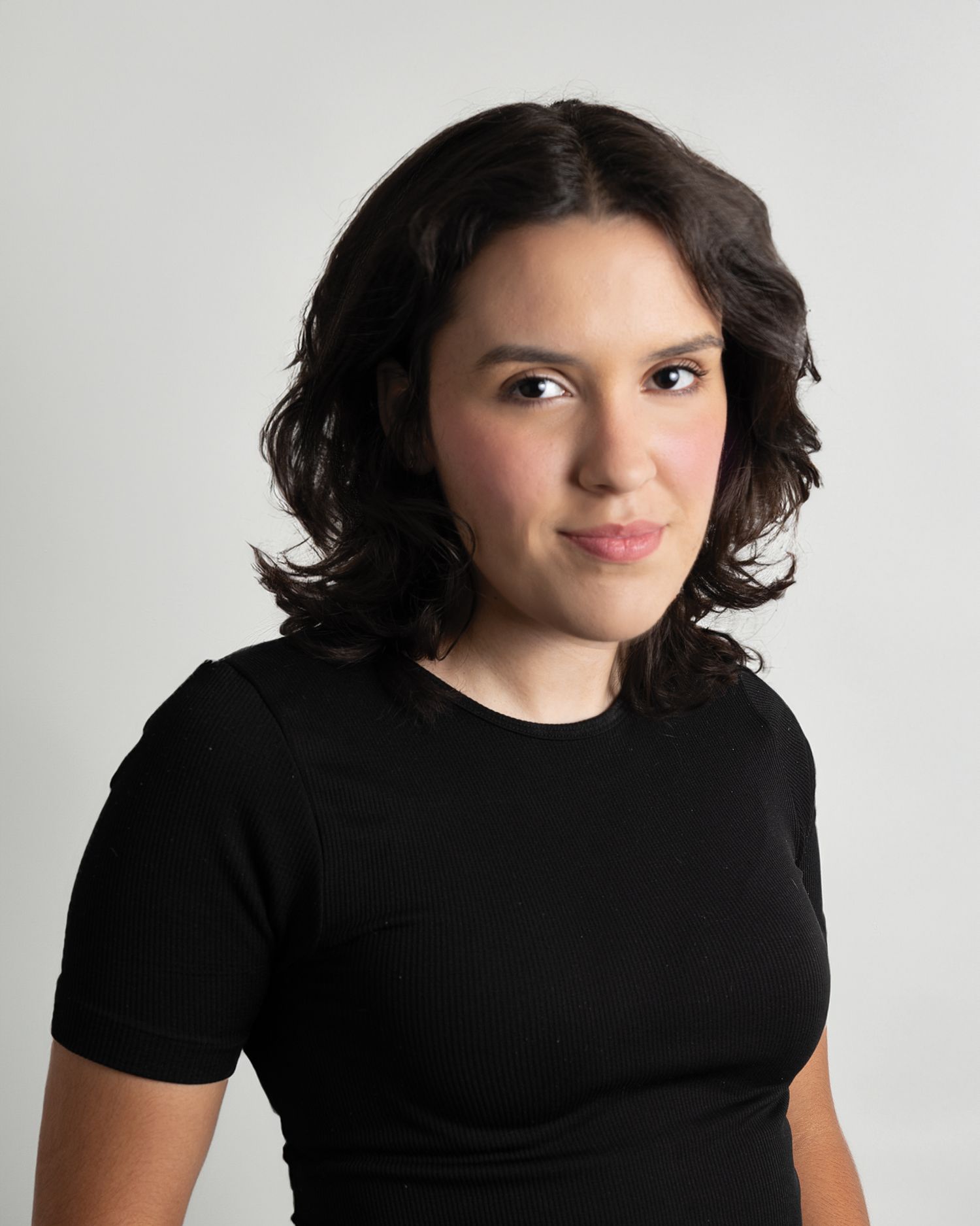 Studio portrait series showing a person in a black t-shirt against a white background.