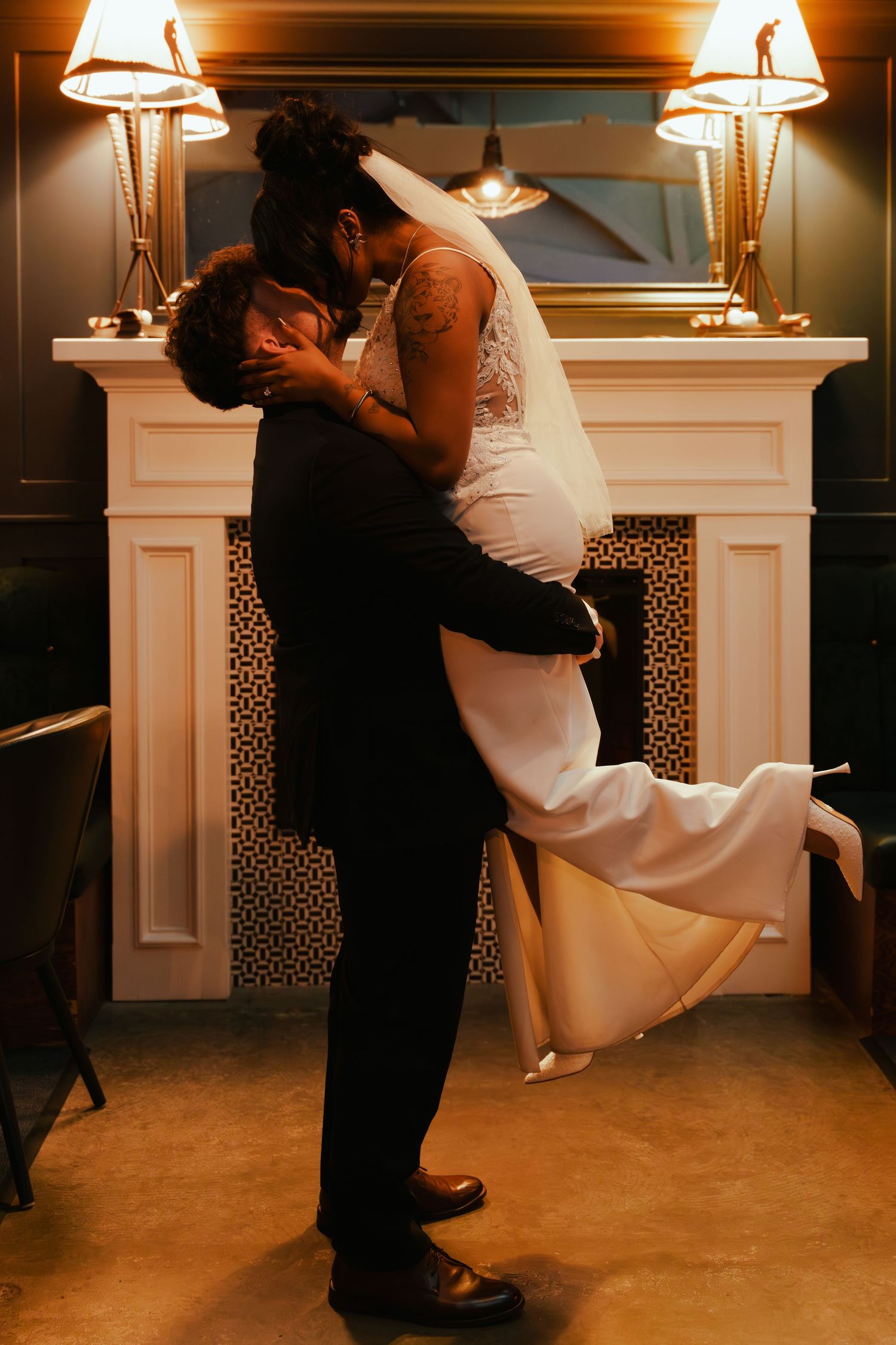 A romantic dance dip sequence shows a couple in formal attire embracing in front of an elegant fireplace.