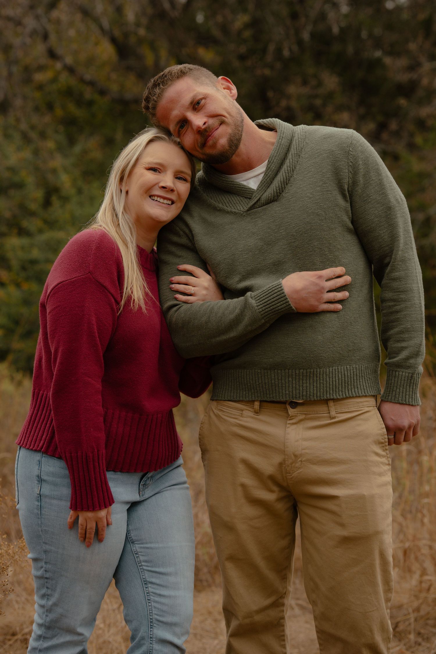 Candid moments of laughter and embraces during an outdoor family photoshoot.