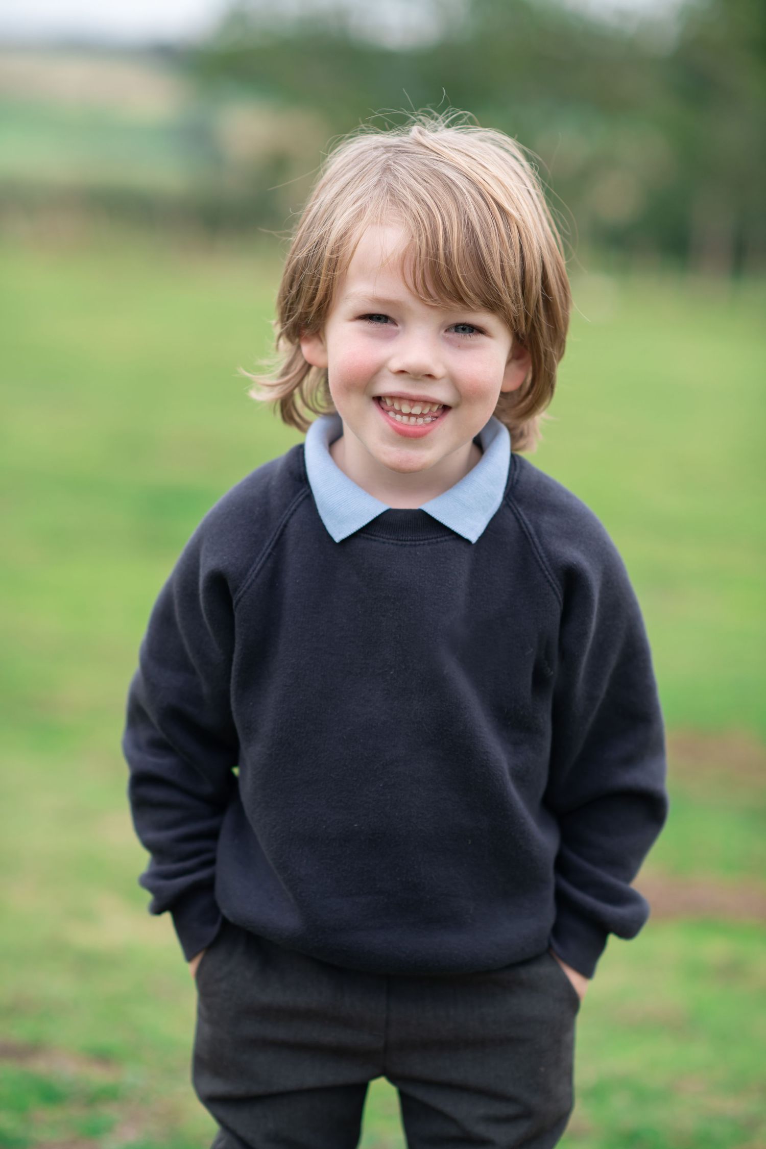 A boy in his school uniform getting photographed in a natural way in Harrogate, North Yorkshire