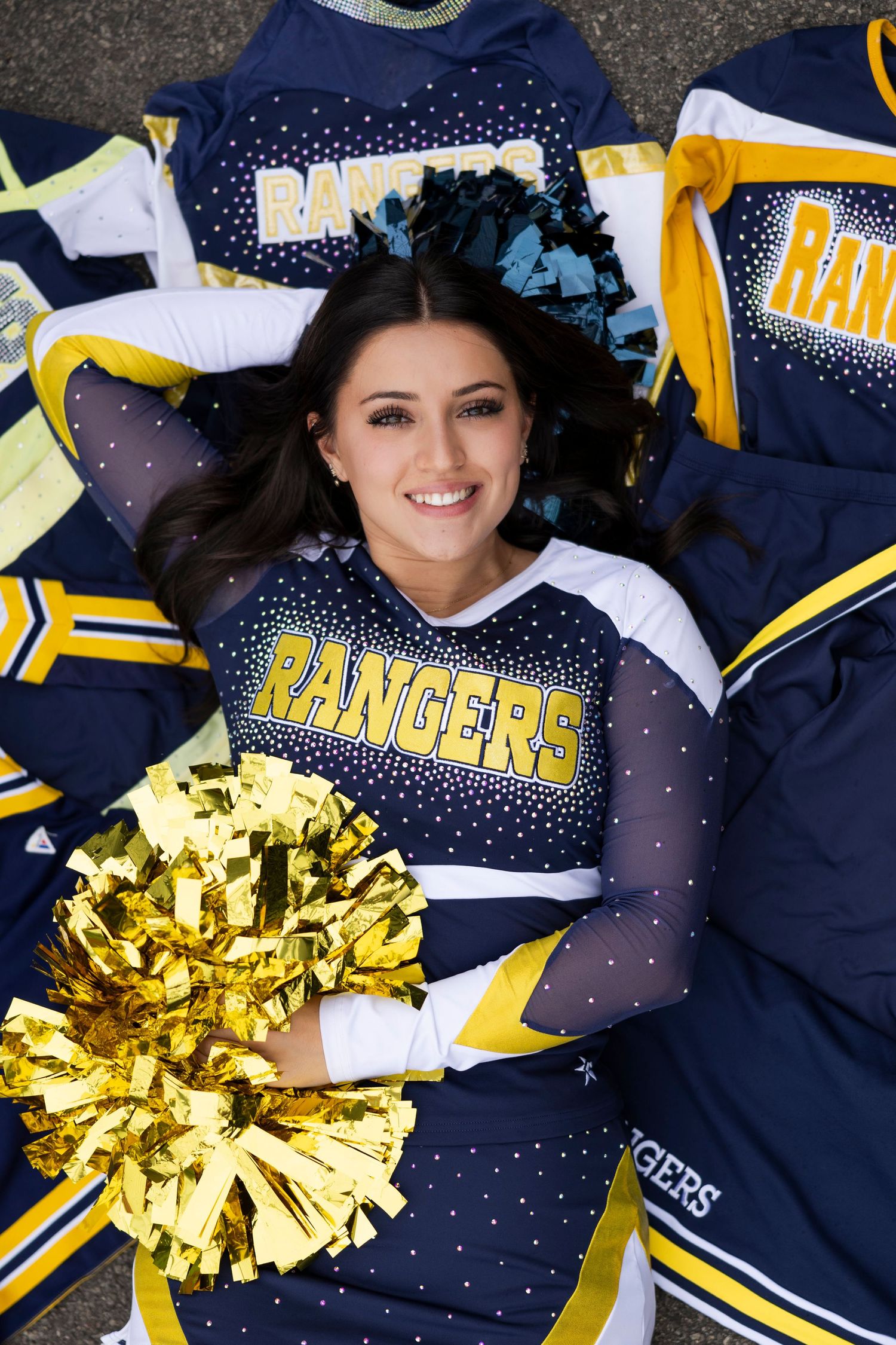 Spencerport cheerleading uniform collage featuring Rangers team colors of navy and gold with pom poms for cheer senior photos.