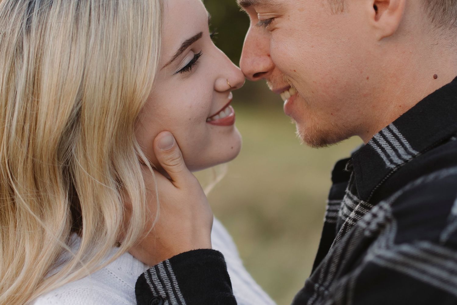 Intimate close-up moments captured in a romantic outdoor photo sequence.