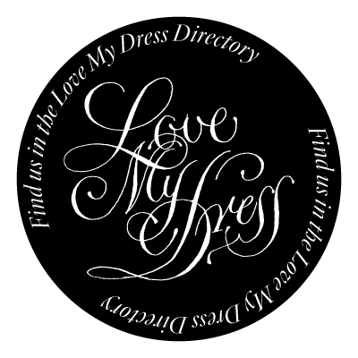 Circular black logo with cursive 'Love My Dress' text in white calligraphy.