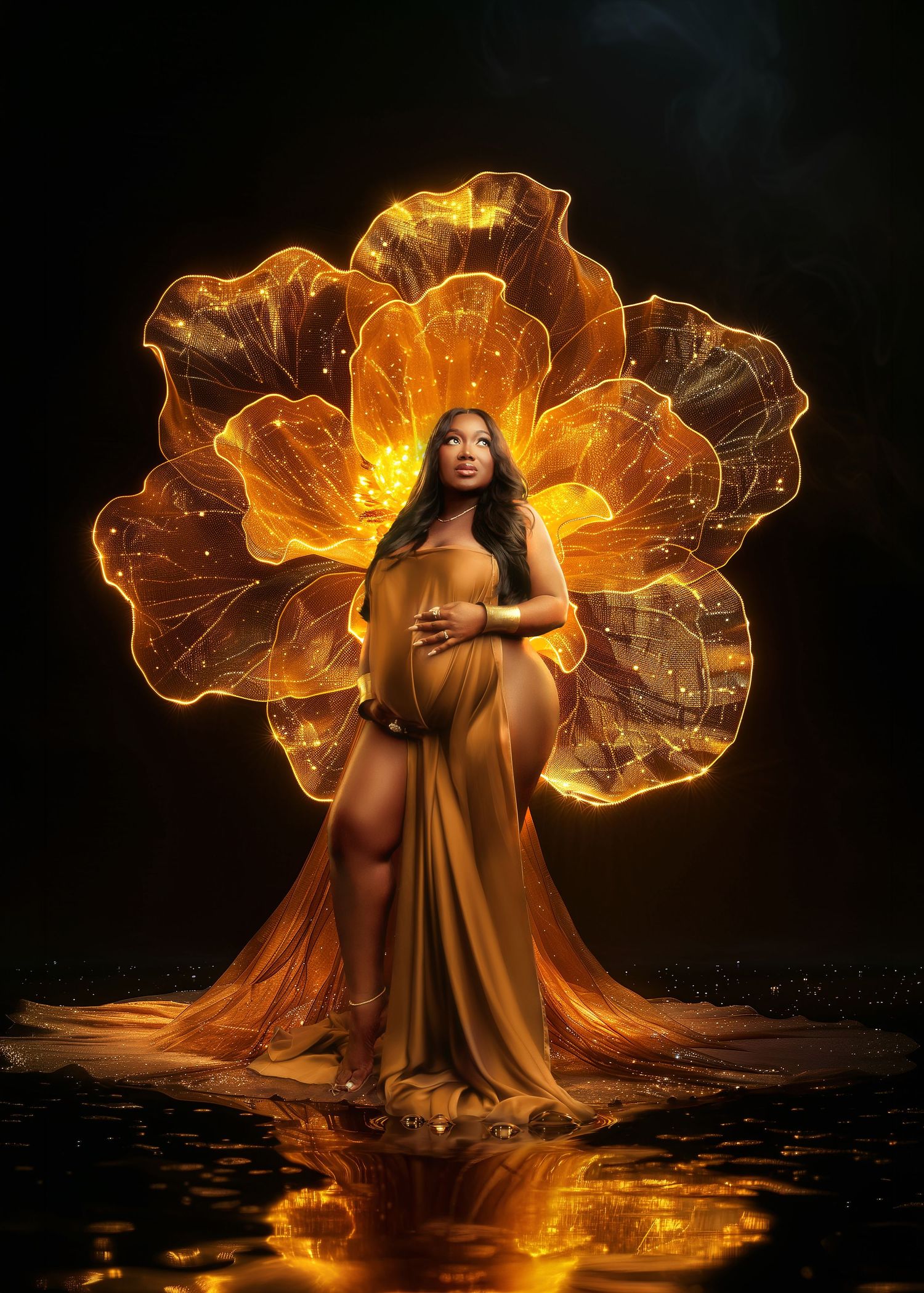 Pregnant woman in golden gown posed before glowing amber flower backdrop in dramatic dark artistic maternity photo.
