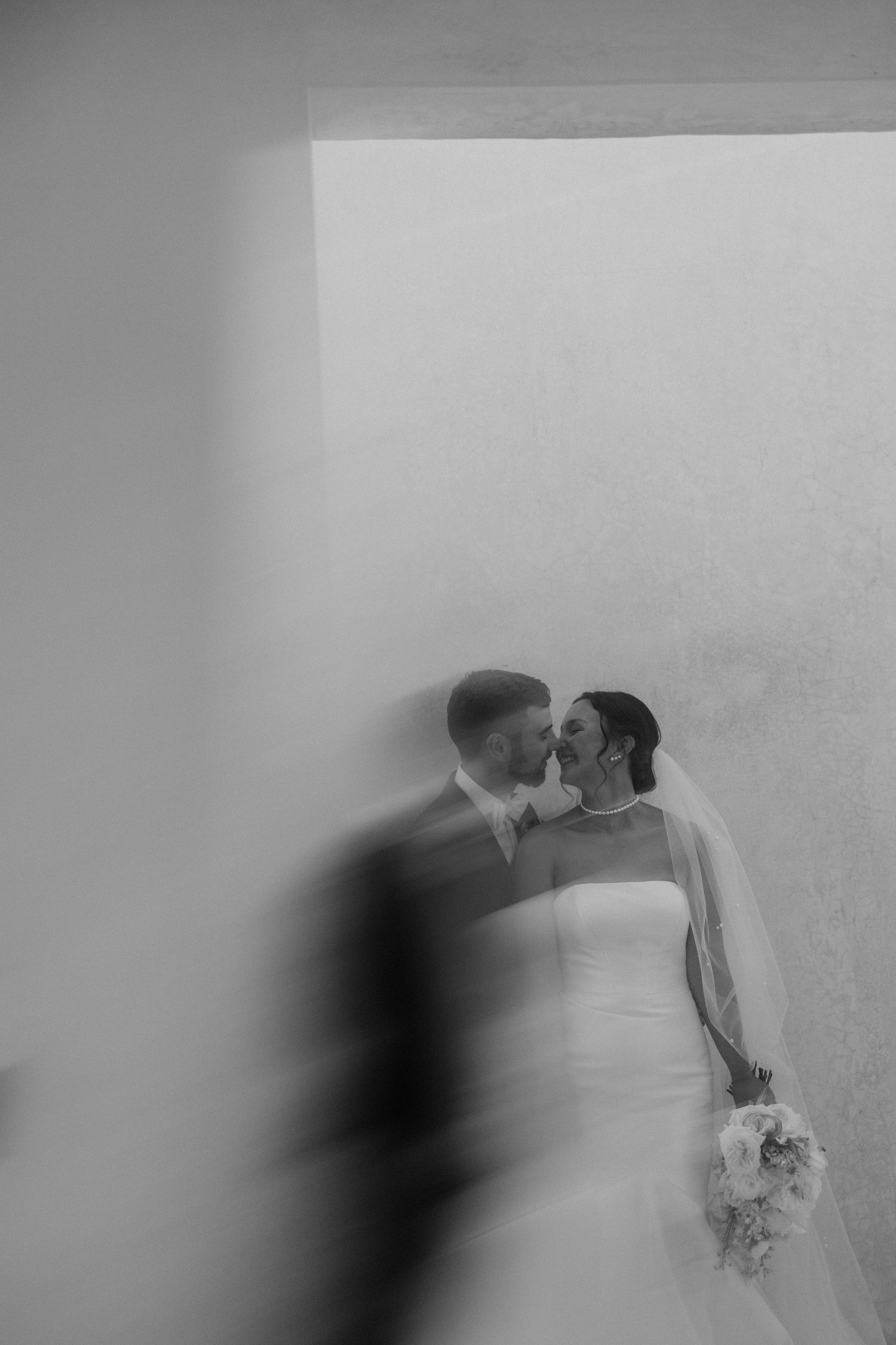 Artistic blurred photo of bride and groom sharing an intimate moment during a luxury Tulum wedding at 16 Tulum