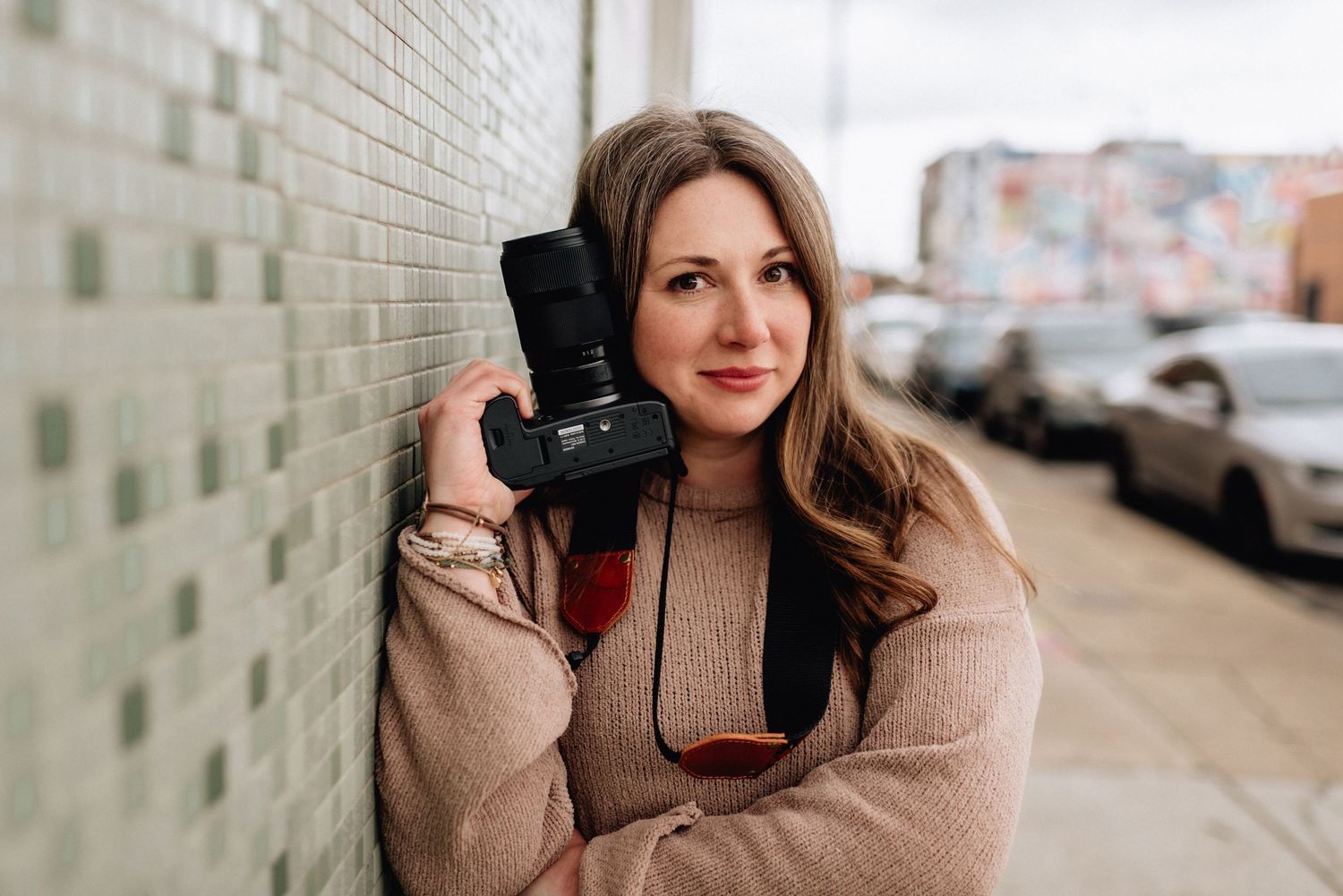 jessica hubbard jess nicole photography with camera in downtown norfolk, virginia