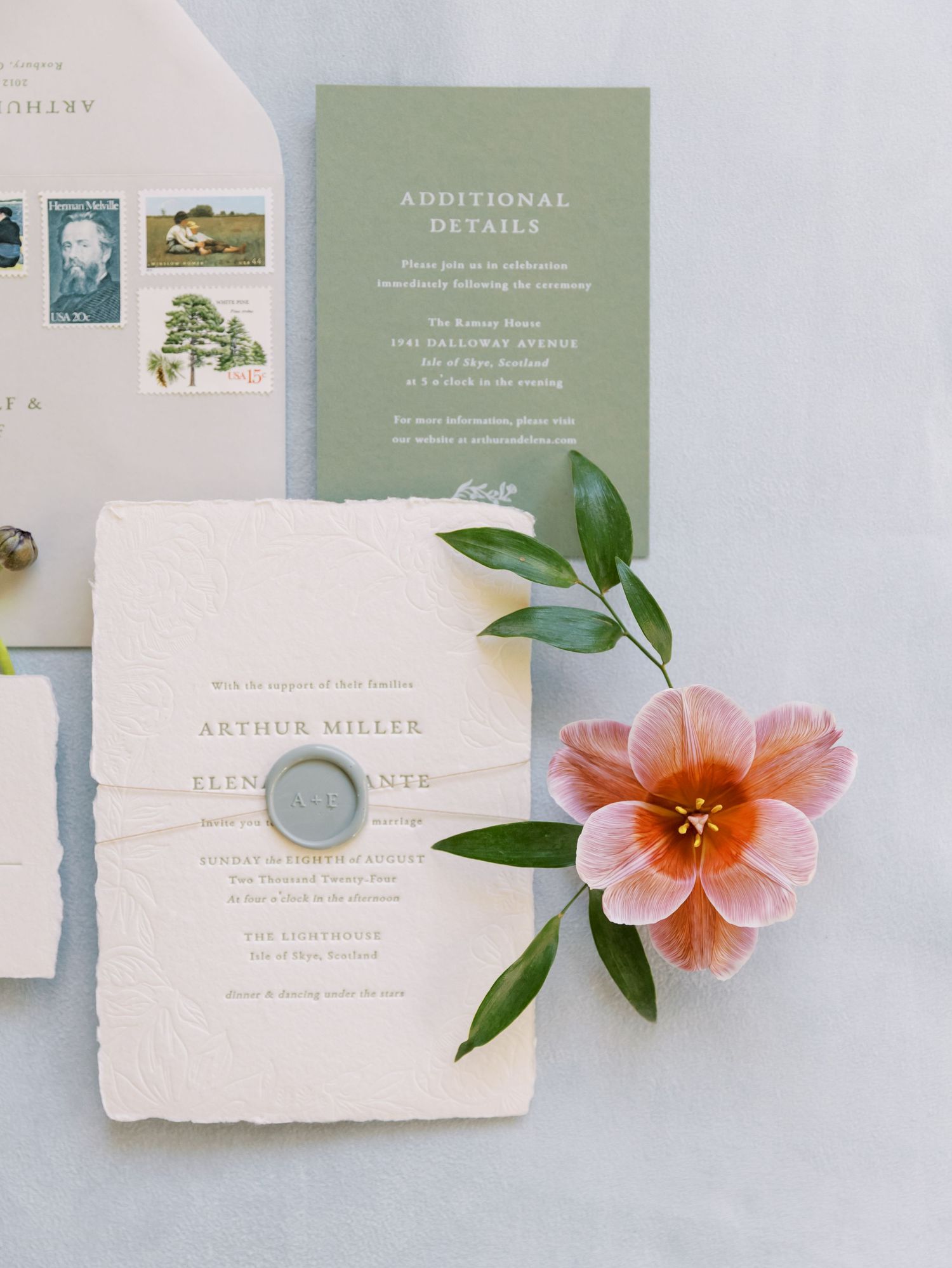 Wedding invitation suite with handmade paper, sage green details, pink flower and vintage postage stamps.