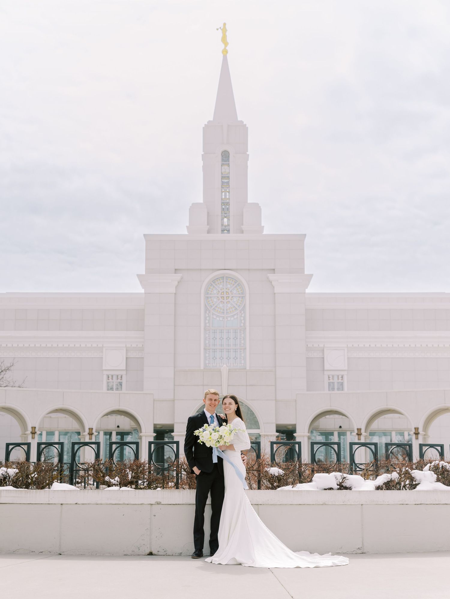 A series of elegant wedding photos taken at the Bountiful Utah Mormon Temple with white architecture and palm trees.