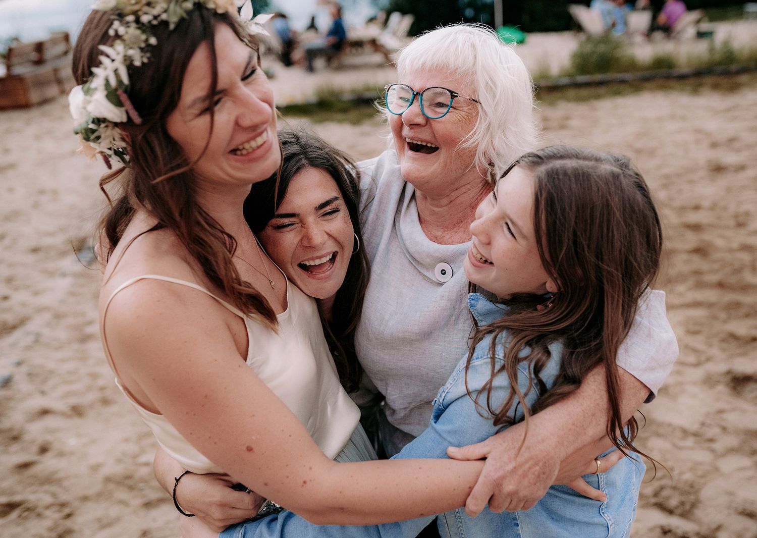 A heartwarming moment of laughter and hugs shared during an outdoor celebration.