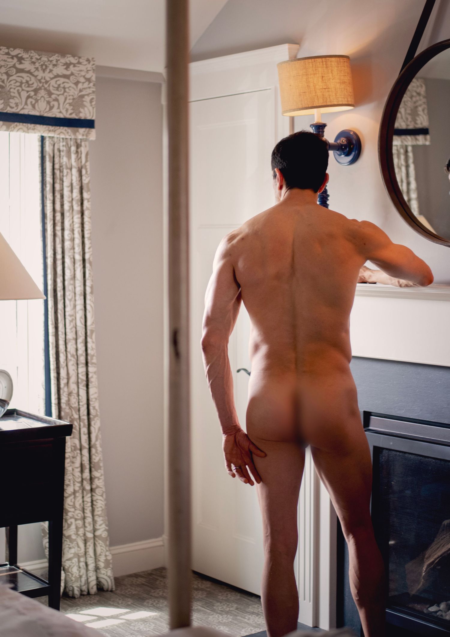 Dark and luxurious dudeoir session in Las Vegas celebrating authenticity and power. Luxury men’s boudoir session featuring dark tones.
