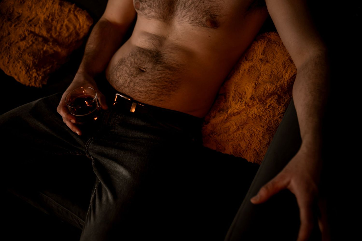Fine art men’s boudoir photography — moody lighting, rich tones, and bold confidence. men’s boudoir photography highlighting form, texture,