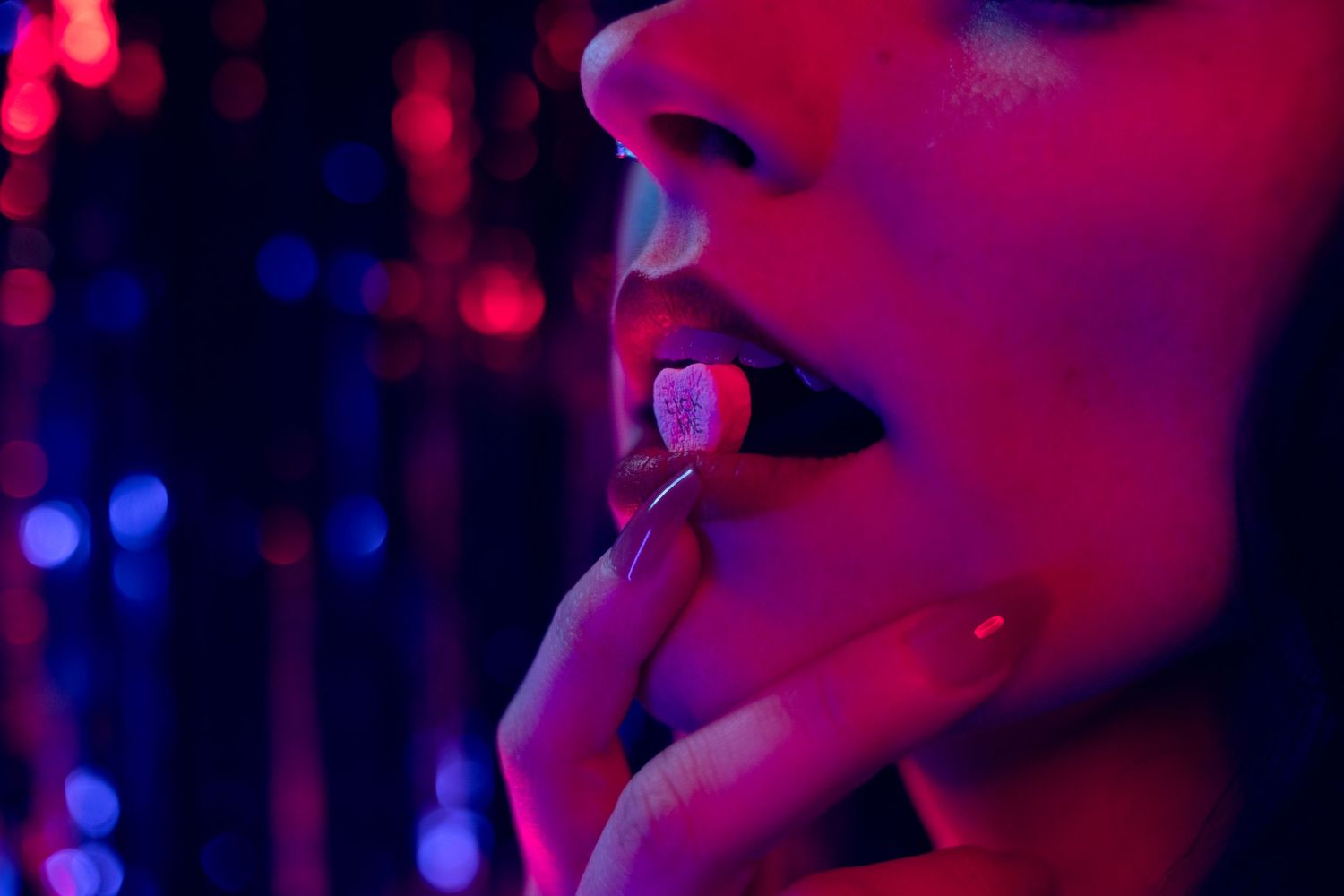 Neon-lit boudoir portrait in Las Vegas — bold colors, dark tones, and pure confidence. Moody detail photo featuring glowing neon reflections