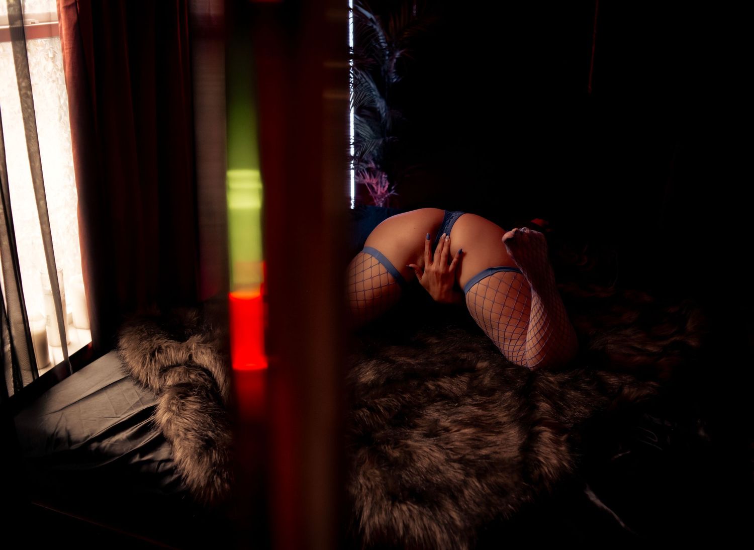Dark and moody boudoir photo capturing a sensual, confident pose with luxury styling. Empowering and sexy boudoir portrait in Las Vegas.