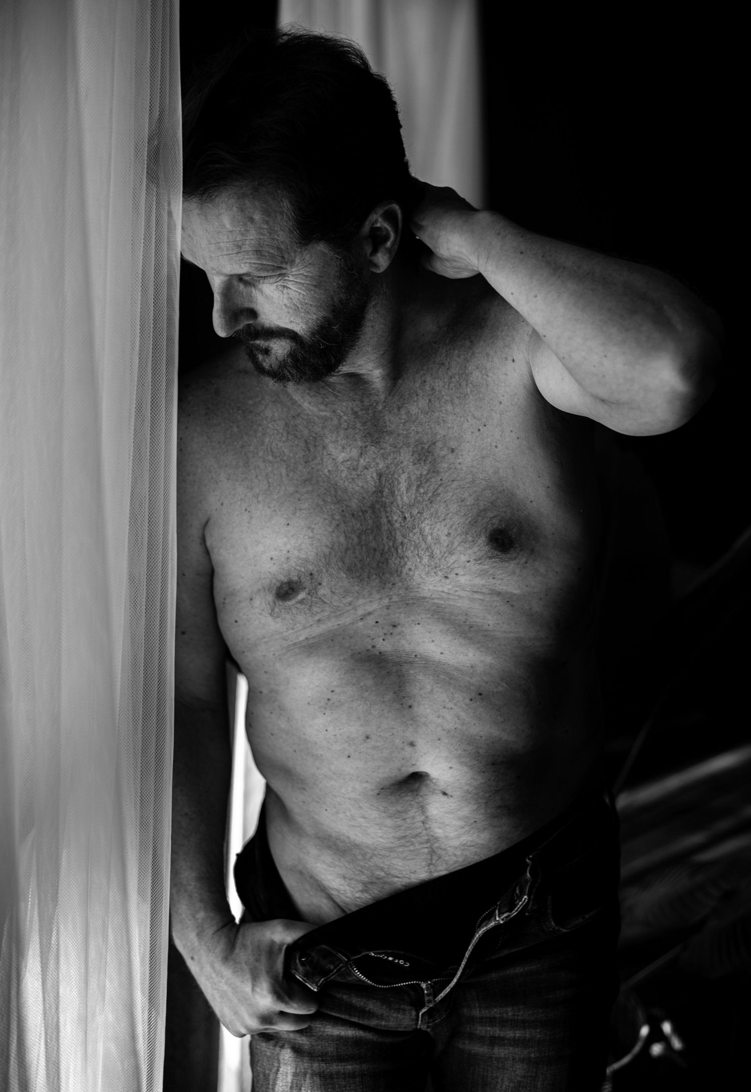 Las Vegas dudeoir portrait focusing on confidence, authenticity, and style. Empowering fine art male portrait — moody, refined, & beautiful