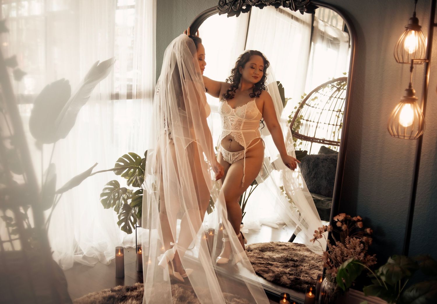 Elegant bridal boudoir photography in Las Vegas with dark, moody tones and luxurious styling. Dark and intimate bridal boudoir portrait.