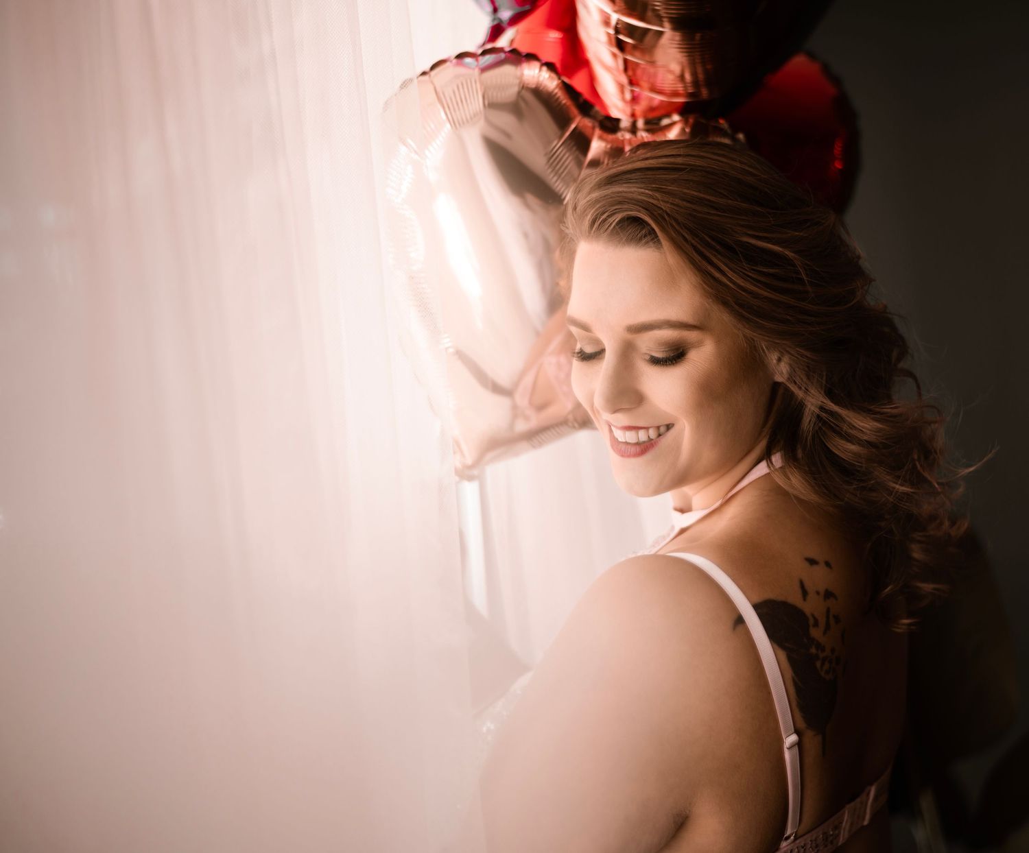 Dark and moody boudoir detail shot capturing the curve of a shoulder and the softness of light. Empowering fine art detail portrait. vegas.