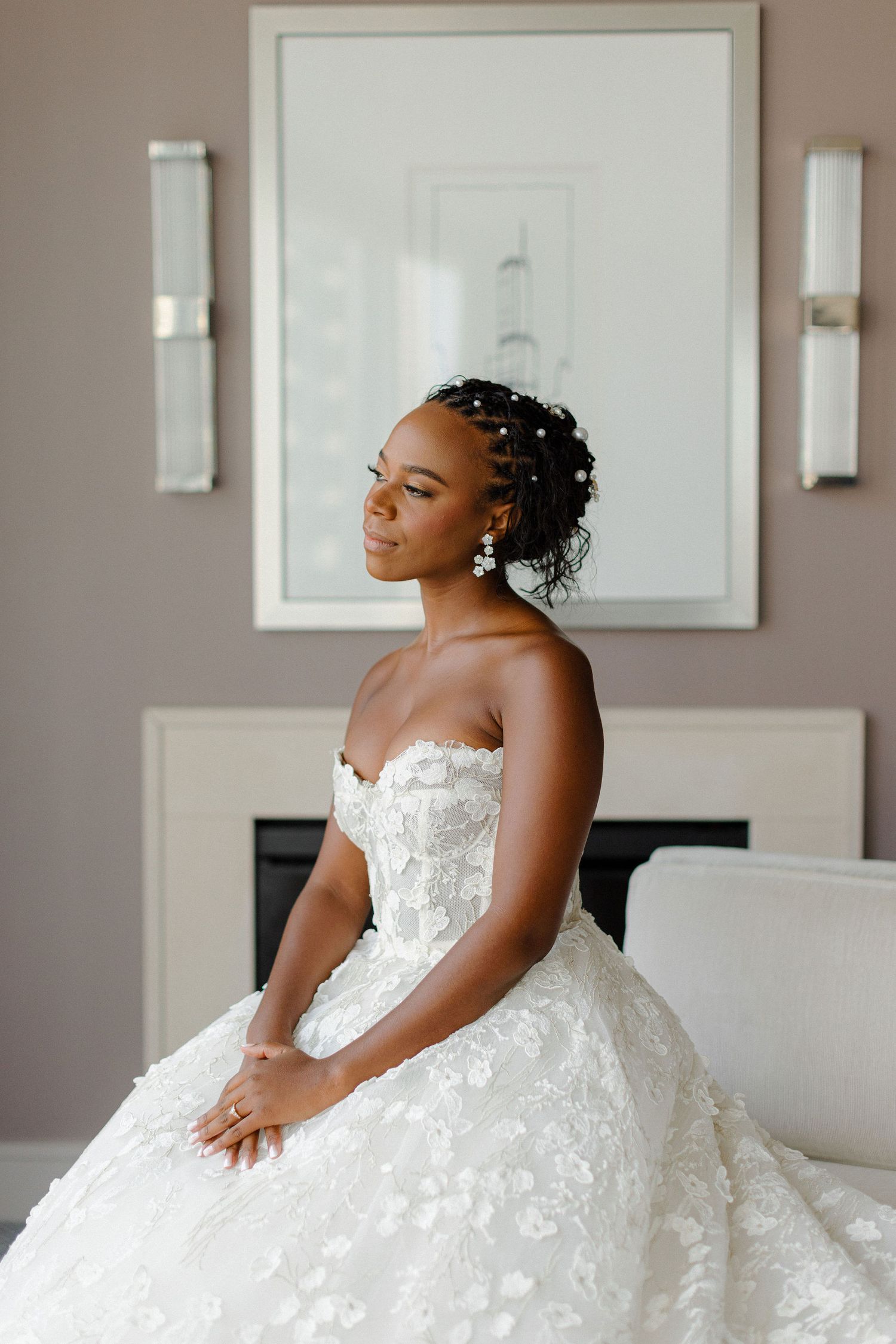 Elegant bridal portrait showcasing a stunning white lace ballgown.