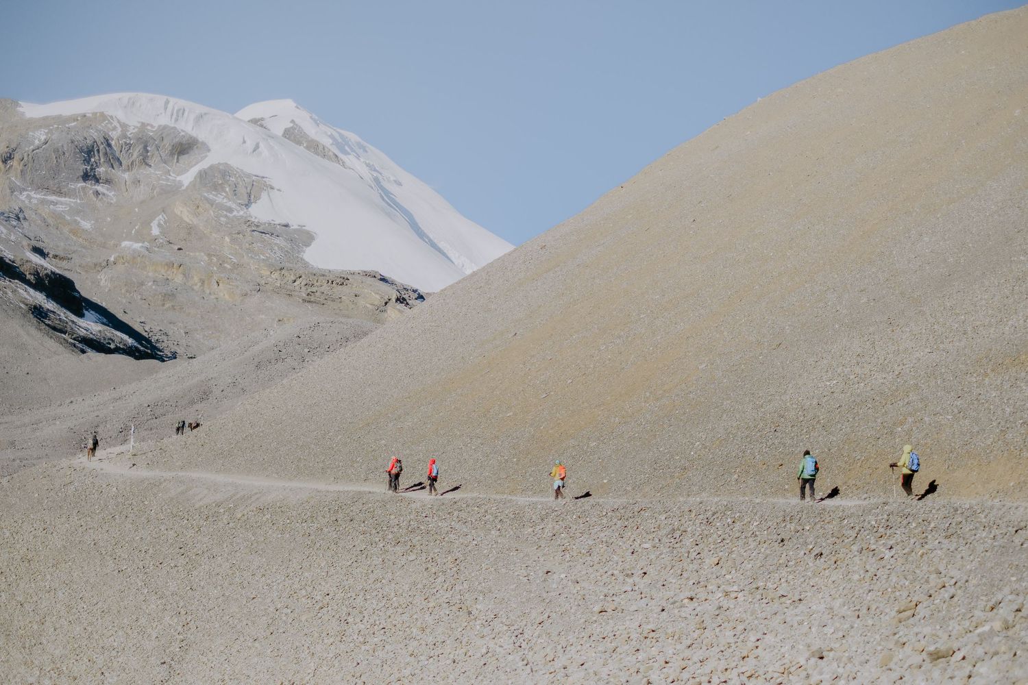 Trekkers Walking Up To Thorong La Pass