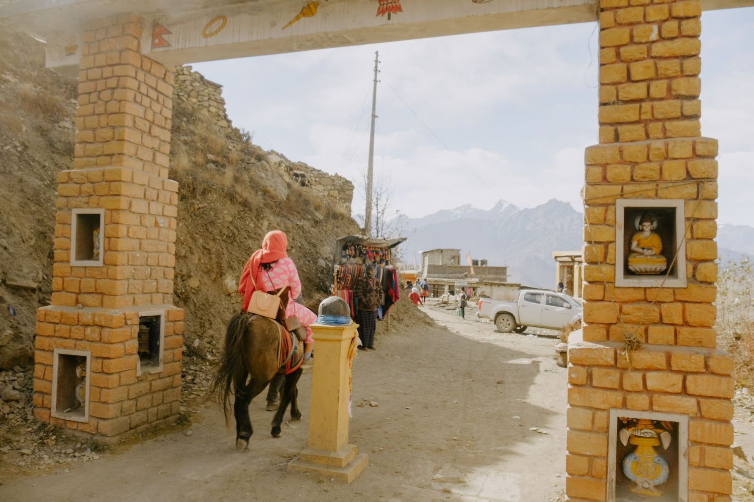 Ancient stone buildings and pathways in a mountainous village setting.