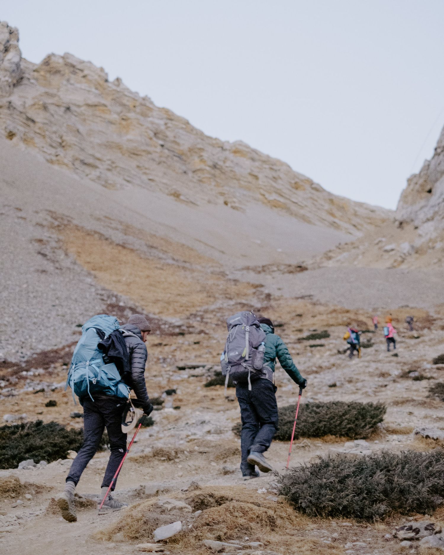 Two Trekkers Climbing To Thorong La Pass