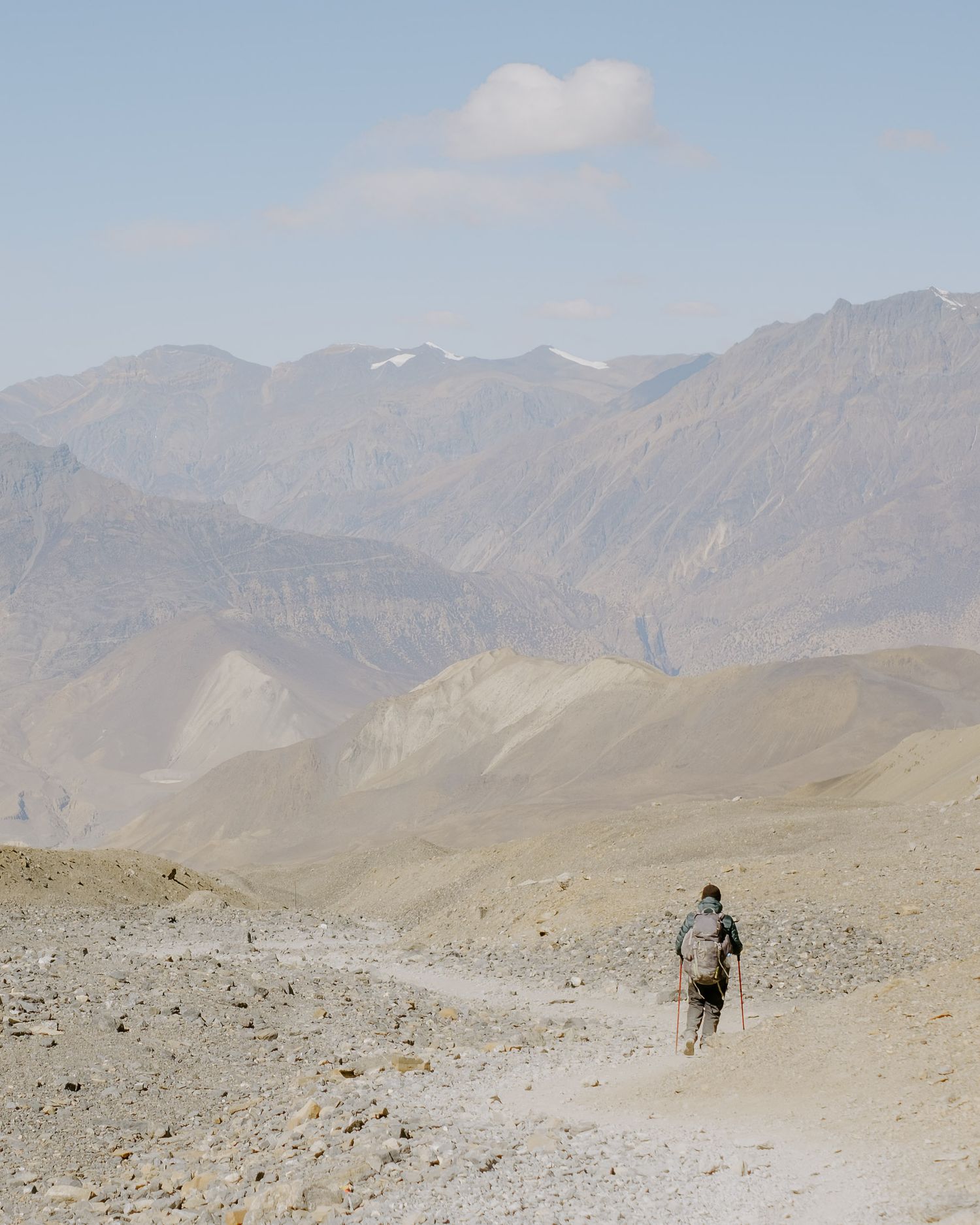 Trekker Going Down From Thorong La Pass to Muktinath