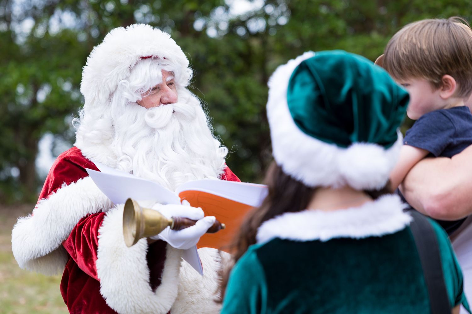 A collage of holiday photos showing people in festive winter attire and Santa costumes interacting outdoors.