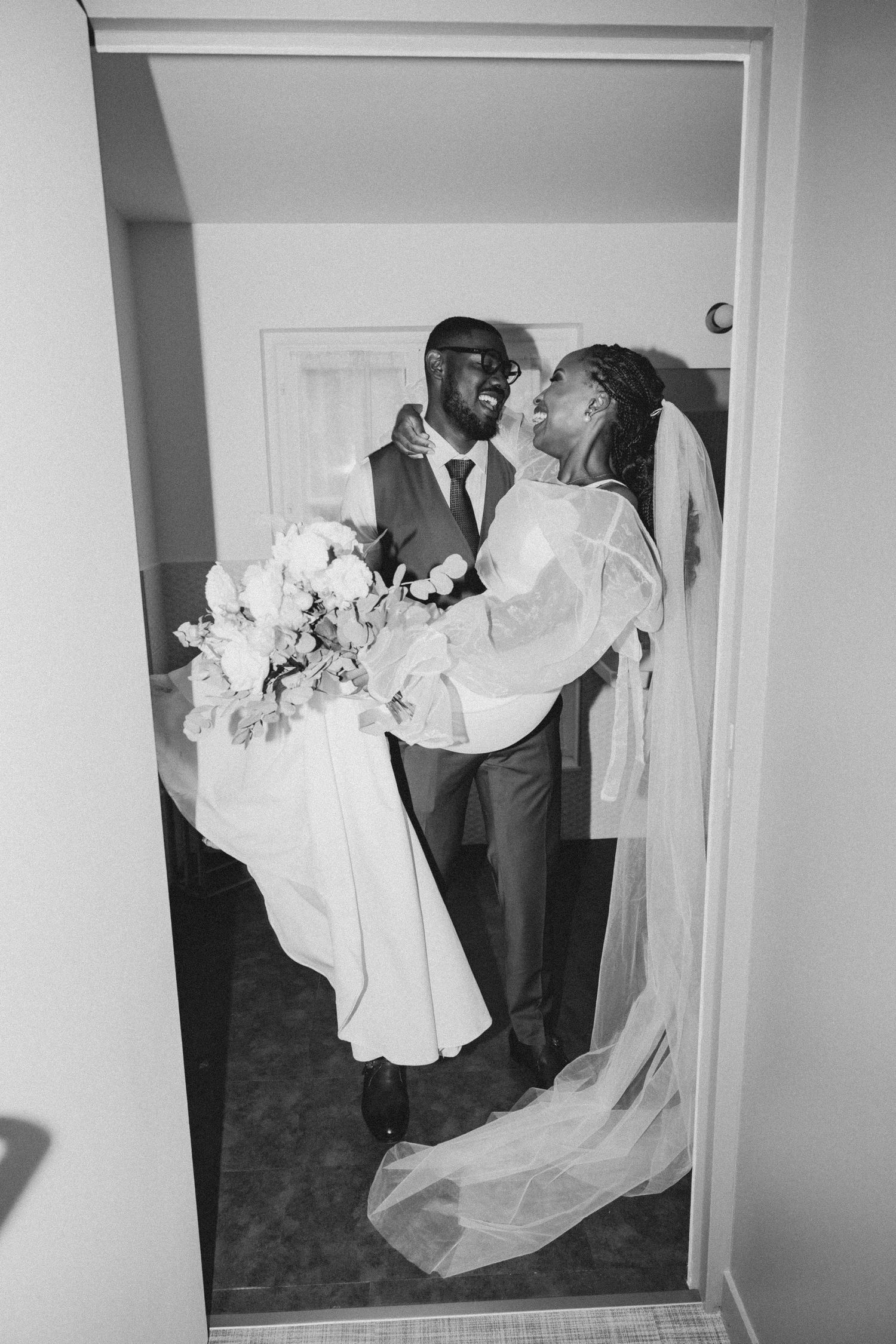 Black and white wedding photos showing romantic dance moments captured in mirrored reflections.