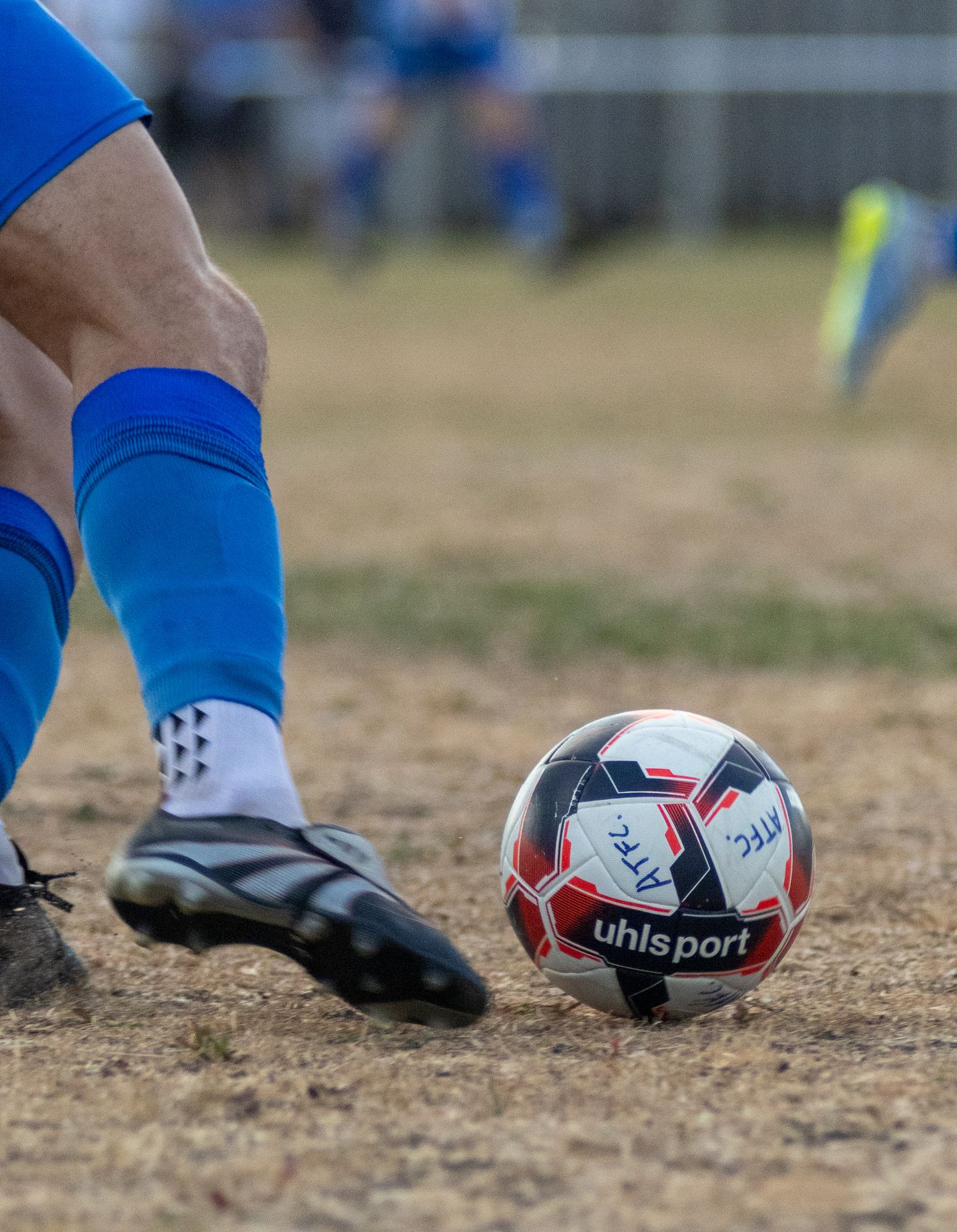 Amesbury town fc player and ball