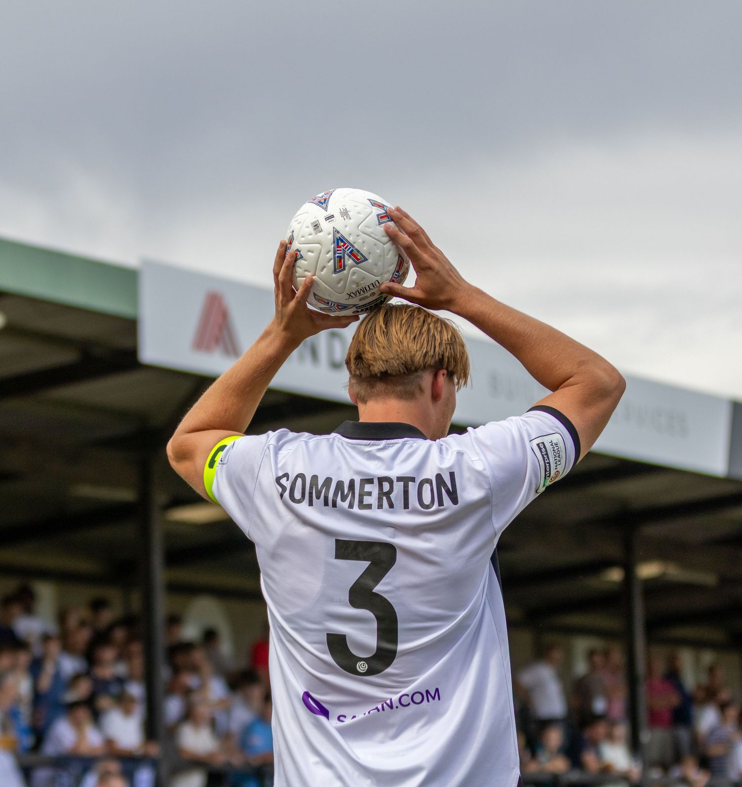 Sommerton number 3 prepares to take a throw-in during a Salisbury FC football match.