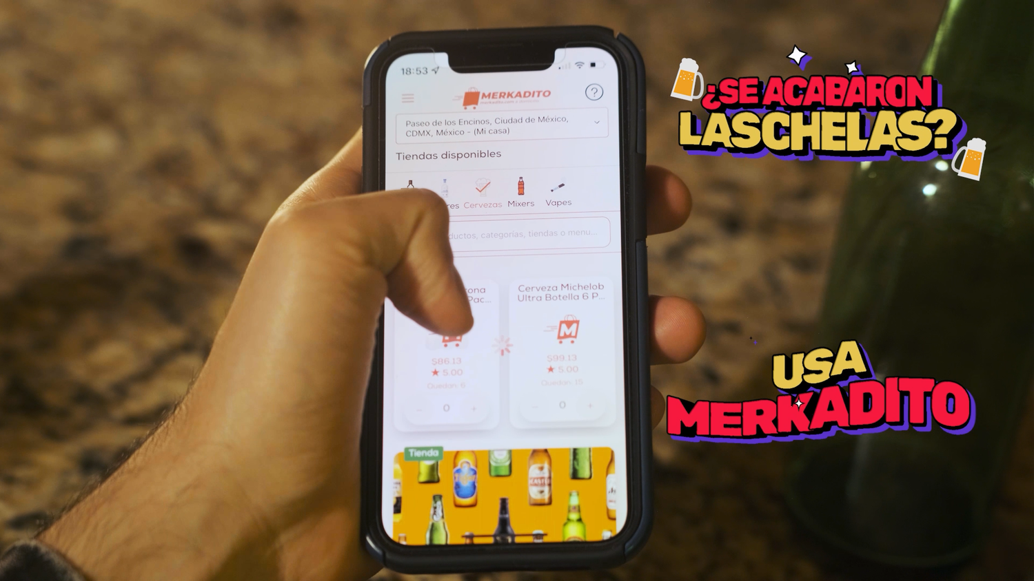 Hand holding smartphone displaying Merkadito app with promotional text Se Acabaron Las Chelas Usa Merkadito.