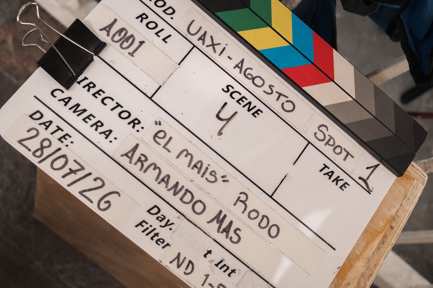 Film clapperboard for production UAXI showing scene details, director Rodo, camera Armando Mas.