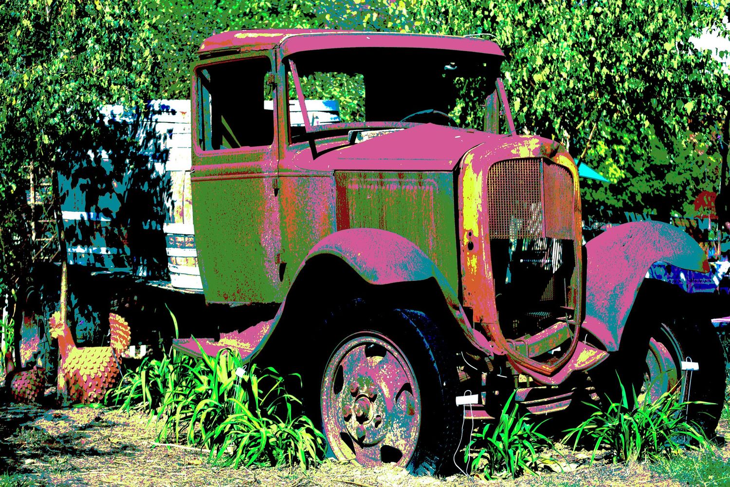 Vintage rusty abandoned truck with colorful posterized effect surrounded by green trees and plants.