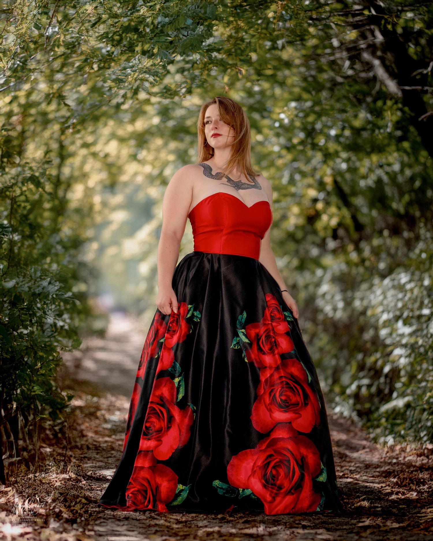 A long red and black floral dress photographed in sequence against a wooded forest path with natural lighting.