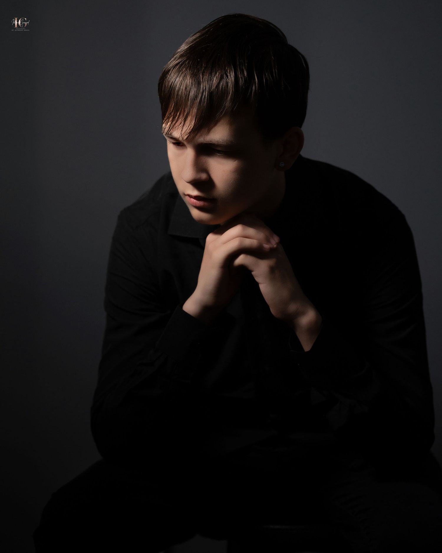 Dramatic low-key portrait series showing silhouette against dark background.