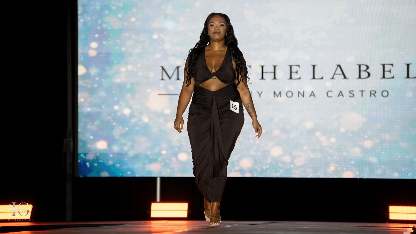 Model walks runway in black evening dress at M Castro Label fashion show.