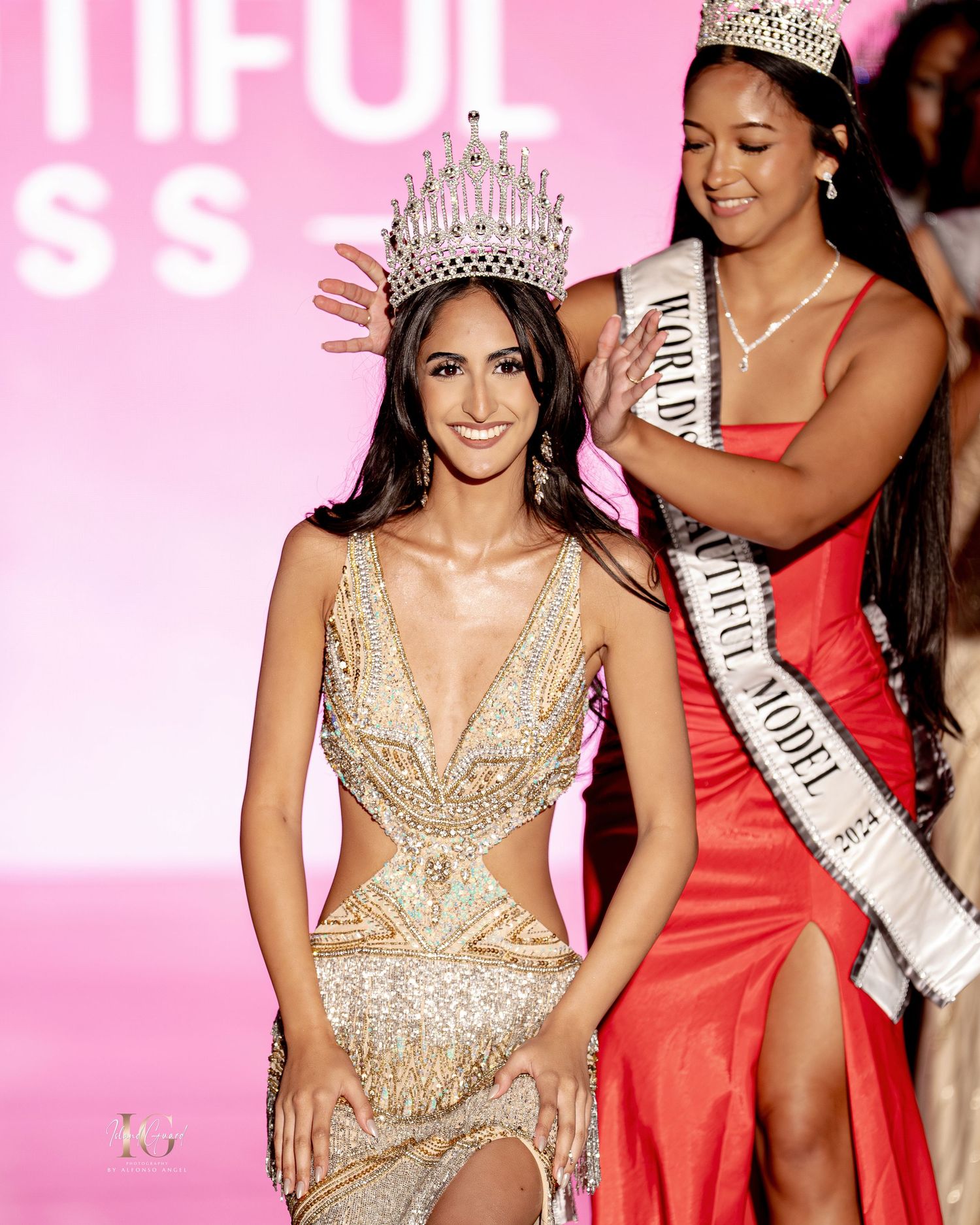 A beauty pageant contestant in a sparkling gold evening gown and crown poses on a pink-lit stage.