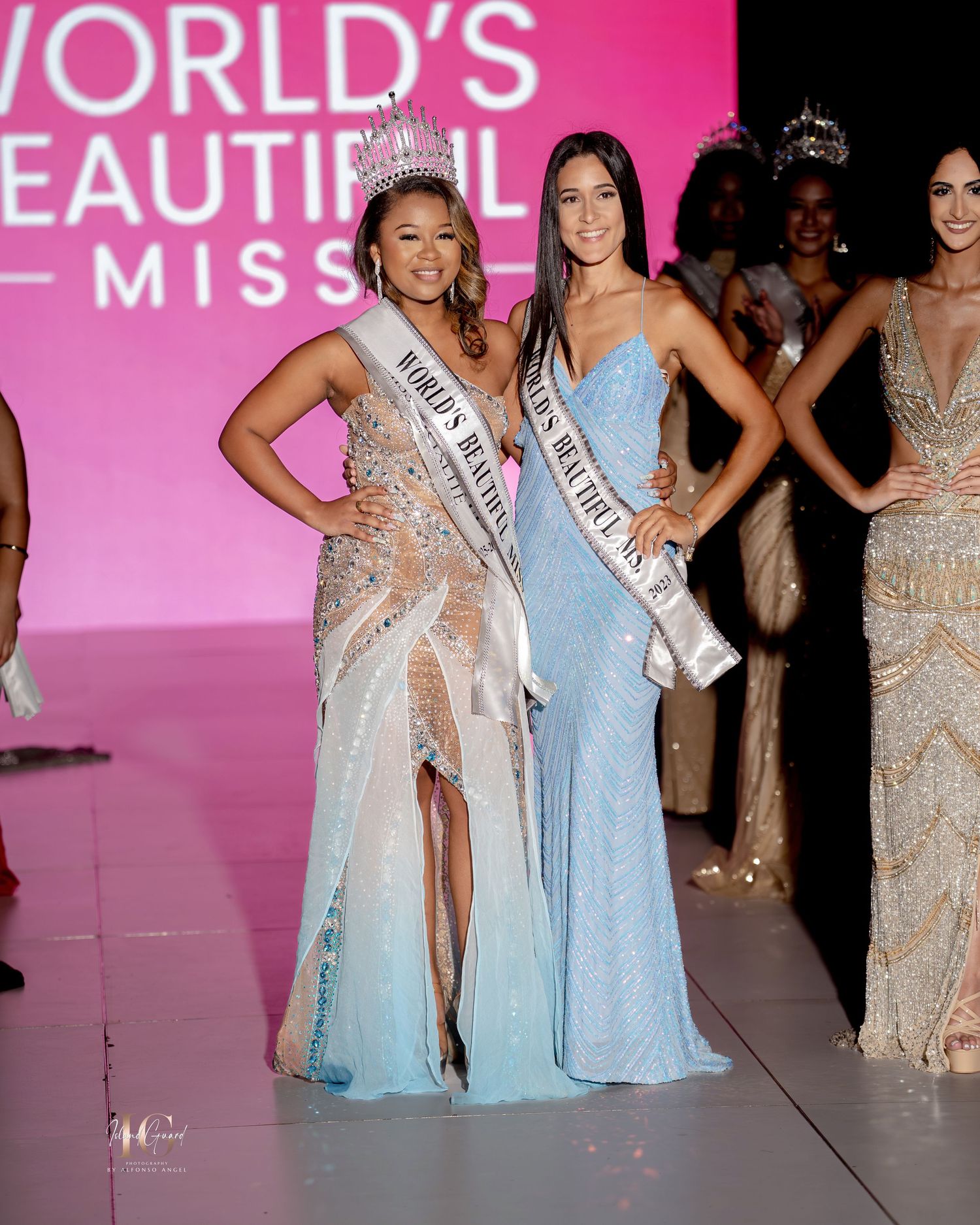 Beauty pageant contestants in elegant evening gowns pose on stage at World's Beautiful Miss competition.