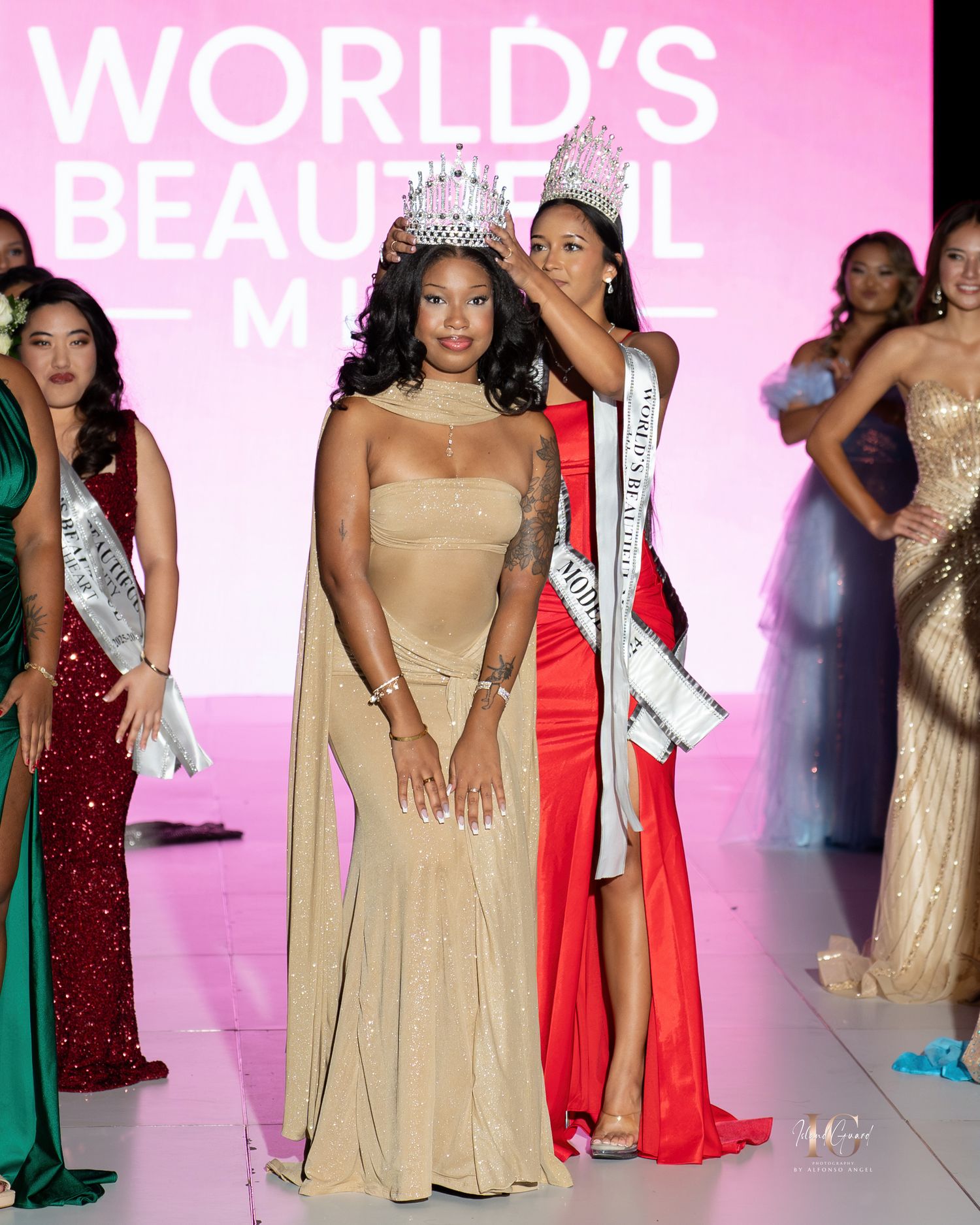 Beauty pageant contestants in elegant evening gowns pose on stage during a competition event.