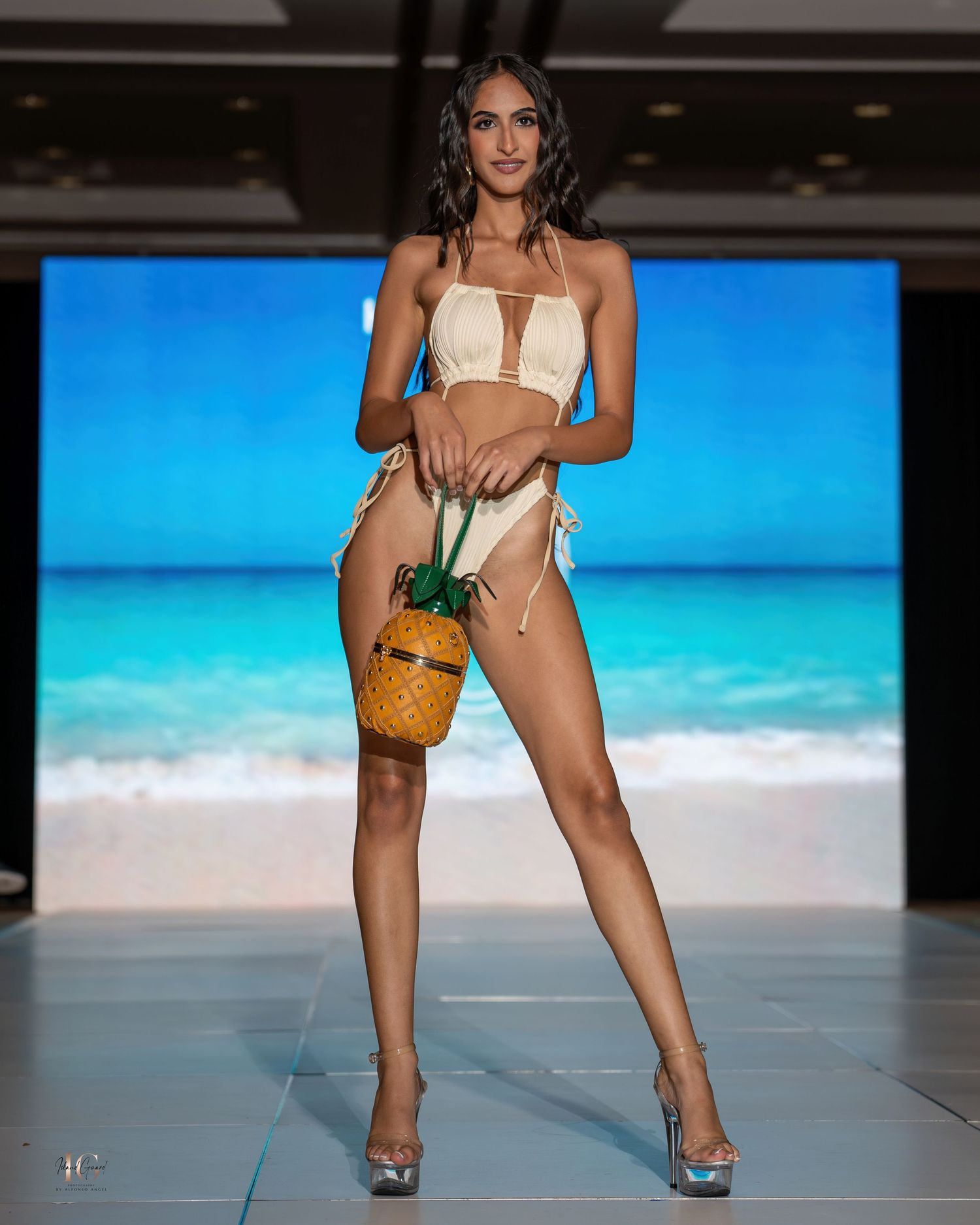 Models showcase summer accessories and swimwear on beachwear fashion runway.