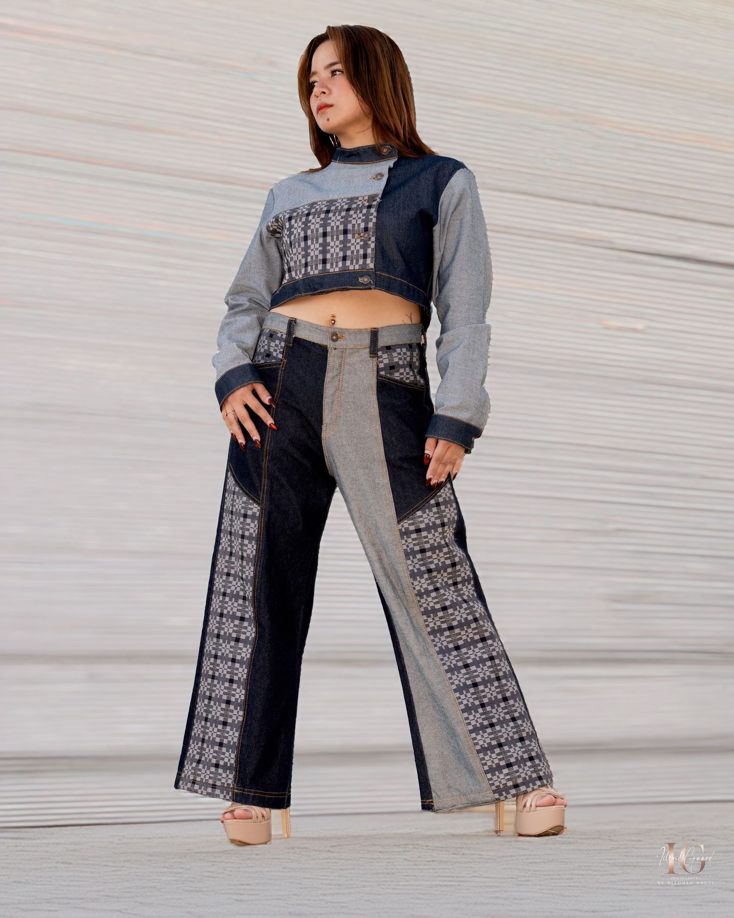 Two-tone denim jeans featuring navy and gray color blocking with unique geometric pattern panels on the legs.