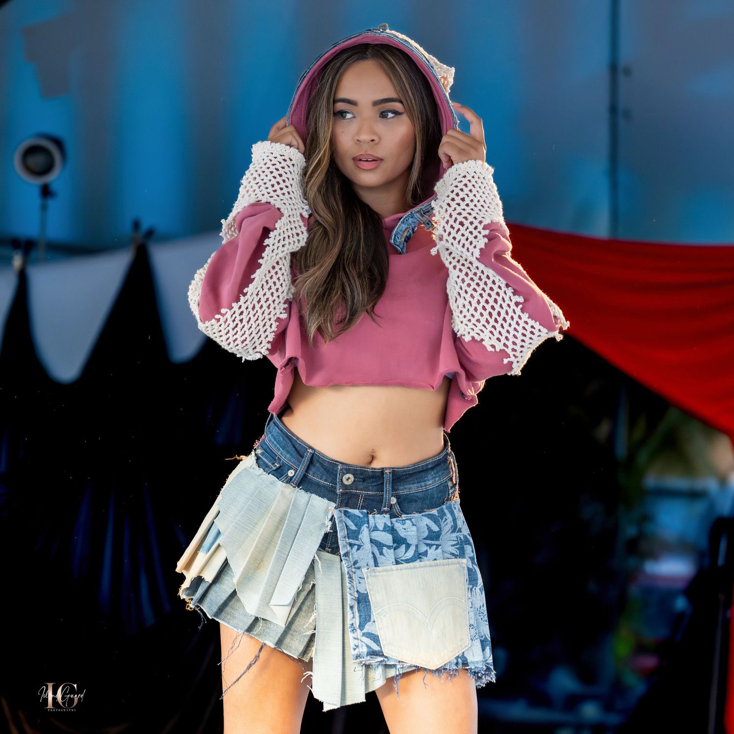 Fashion show featuring pink cropped hoodie with ruffled sleeves and denim shorts.