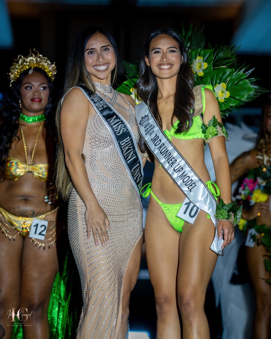 Pageant contestants pose in formal and swimwear attire on stage with sashes during an evening competition event.