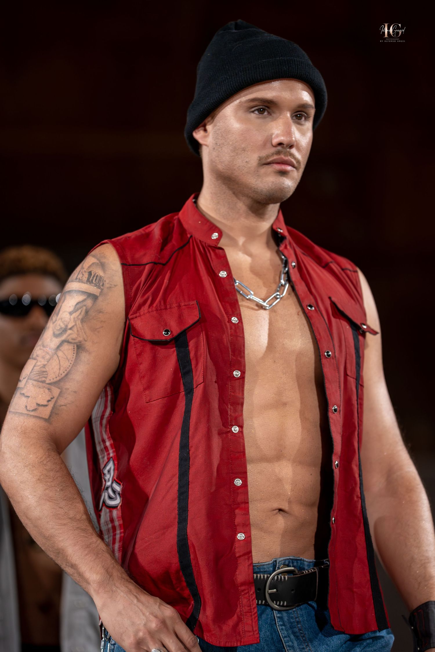 A muscular person wearing a red sleeveless shirt and jeans poses in multiple shots against a dark background.